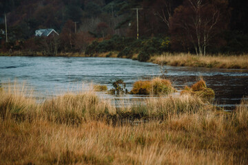 Acharacle, Scotland Highlands - River Shiel with clouds covering the mountains in the background on an overcast Autumn morning