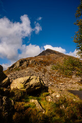 Fototapeta premium Rocky mountain slope under blue sky in Snowdonia National Park, Wales