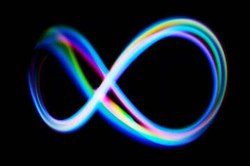 Vibrant Infinity Loop. A colorful neon infinity loop glows against a black background