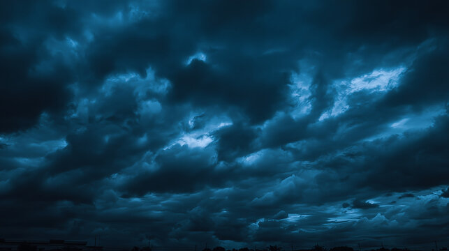 Dramatic dark storm clouds gathering before heavy rain in the evening sky - Powered by Adobe