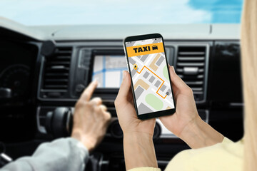 Woman sitting in taxi that she called via mobile phone app, closeup