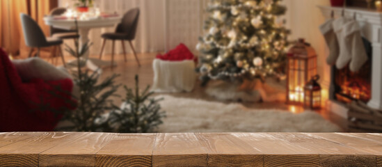 Empty wooden table in room decorated for Christmas. Space for design