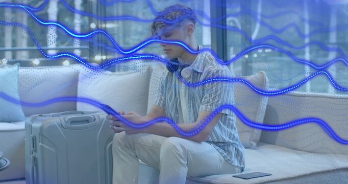 Man tapping smartphone and wheeling suitcase as animated blue waves guiding travel path