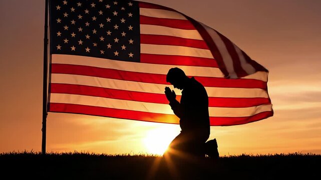 Silhouette Figure Praying In Front Of An American Flag At Sunset