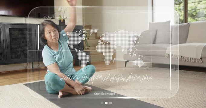 Senior woman extending arms activating transactions map and Cost Estimates chart guided stretching