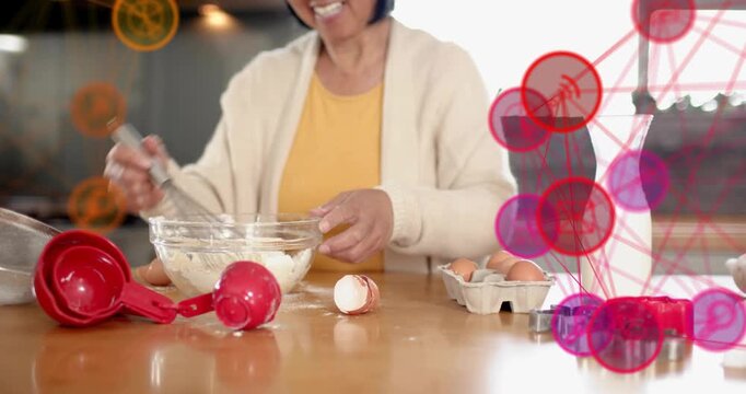 Woman cracking eggs whisking batter and pouring milk in cooking tutorial, with animated overlays