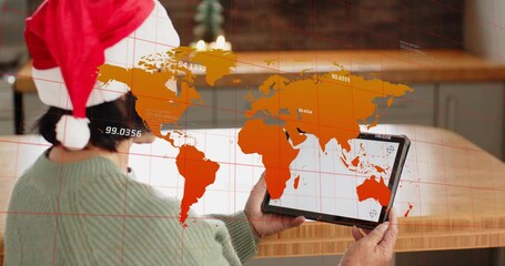 Senior woman holding tablet and generating orange world map overlay cycling stats in IT monitoring - Powered by Adobe