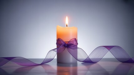 A single burning candle with a purple ribbon on a reflective surface. Concept of remembrance, hope, and spirituality with copy space
