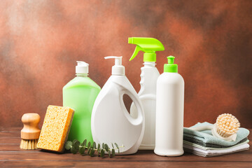 Eco cleaning.Cleaning products on a textured background. Eco-friendly home cleaning. A bottle of natural detergent surfaces, eco brushes, sponges, and rags. Cleaner concept.Cleaning supplies.Flat lay.