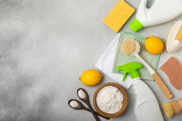 Eco cleaning.Cleaning products on a textured background. Eco-friendly home cleaning. A bottle of natural detergent surfaces, eco brushes, sponges, and rags. Cleaner concept.Cleaning supplies.Flat lay.