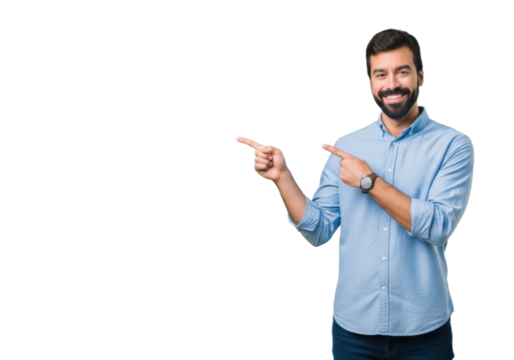 Cheerful young man pointing sideways at empty space