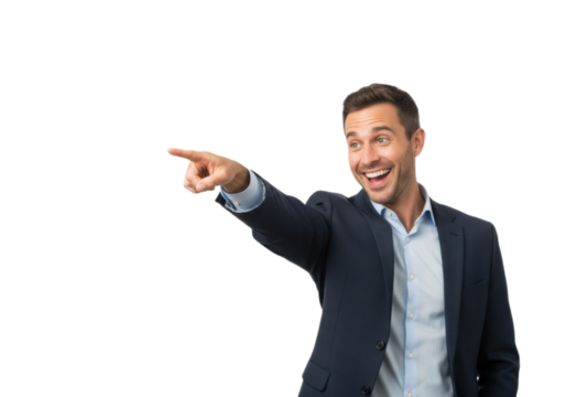 Cheerful young man in a suit pointing sideways at empty space