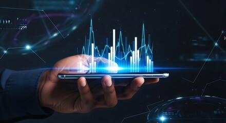 Hand holding smartphone displaying glowing blue financial charts and data visualizations image