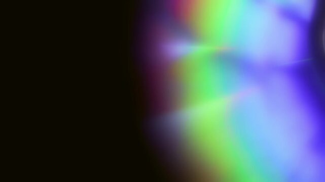 abstract colorful light reflection on a rotating compact disc