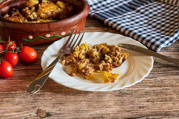 Traditional stuffed cabbage rolls (sarma) served on a plate, featuring tender cabbage leaves wrapped around a savory meat and rice filling. The warm, hearty dish is presented simply, highlighting its 