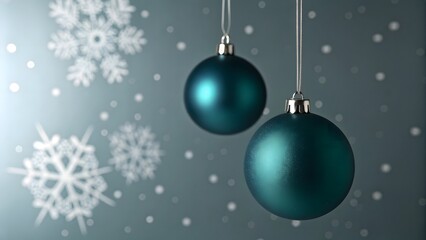 Two shimmering teal christmas ornaments hang in front of a soft focus background with large white snowflakes and falling snow