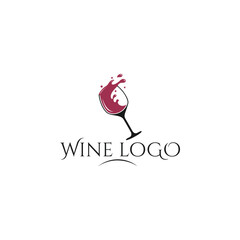 Elegant wine glass logo design with a splash of red wine