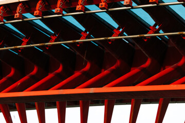 Close-up of red and black industrial machine part with geometric patterns