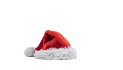 A red santa hat with a white fur trim and a pom pom, lying down and slightly angled in the frame, isolated on white. isolated on white