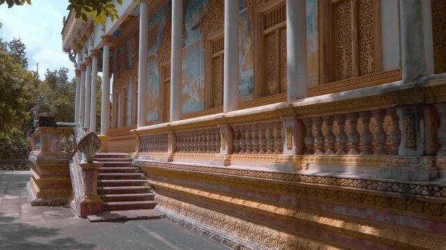 Fascinating modern style paintings of samsara and worldly sins is placed on the wall of Wat Svay Romeat Pagoda in Siem Reap, Cambodia. Shot in motion