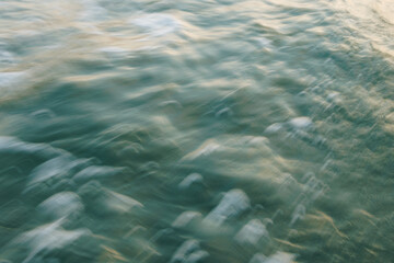 Blurred ocean waves creating a dynamic motion effect