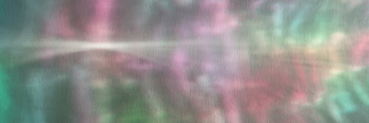 Colorful abstract blurred light patterns with soft pastel hues and dreamy texture.