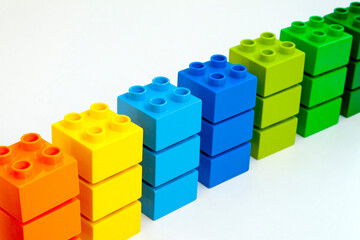 Stacked Colorful Toy Building Blocks on White Background