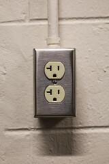 electrical outlets mounted on concrete wall