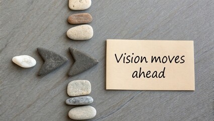 Vision Moves Ahead with Stones and Paper on Gray Background