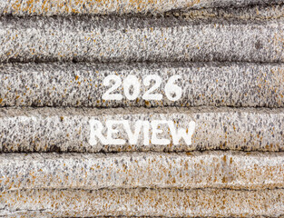 2026 Review symbol. Concept words 2026 Review on beautiful grey mountain wall. Beautiful grey mountain wall background. Business and 2026 review concept. Copy space.