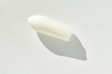 close up of white eucalyptus essential oil soap on light background with shadow.