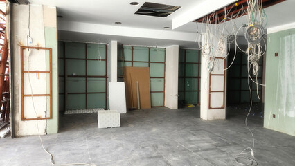 Store decoration works include panels laid on wall profiles, electrical and internet cabling, and tiling work on the floors.