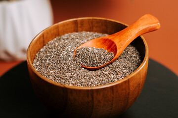 Roasted chia seeds in a wooden bowl ready for healthy snacks