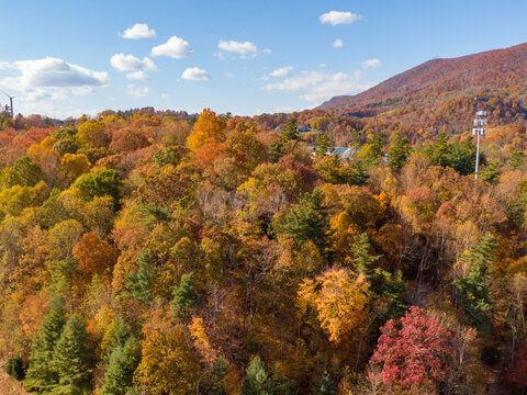 Golden Hour Aerial Drone View of Peak Fall Foliage Over the Appalachian Mountains Near Boone, North Carolina