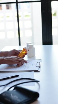 Doctor or authorized medical professional writing the order of specific medication for a patient to treat an illness or injury.