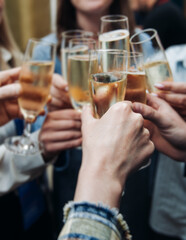 Group of businessmen celebrate acquisition, closing successful merge deal, clinking raise glasses with alcohol, sparkling wine, toasting and cheering, colleagues office team corporate party event
