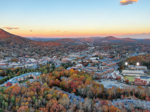 Golden Hour Sunset Drone View of Boone North Carolina Nestled in Vibrant Fall Foliage.