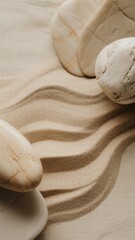 Gentle waves of sandy texture with smooth stones serene indoor setting still life photography