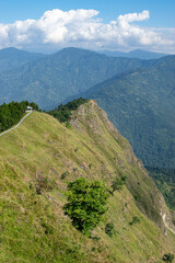 Naklejka premium Tarey Bhir point,favourite tourist spot, Sikkim,India. A long path on the hills, a breathtaking viewpoint at the end of the edge, tourists get spectacular view of Himalayan mountains in front of them.
