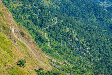 Naklejka premium Sikkim Road down below from view of Tarey Bhir point, popular tourist spot, Sikkim,India. The word 'Bhir' means cliff in the local Nepal language, a breathtaking view at the edge, Himalayan mountains.