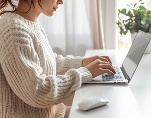 woman working on laptop, minimalist desk setup