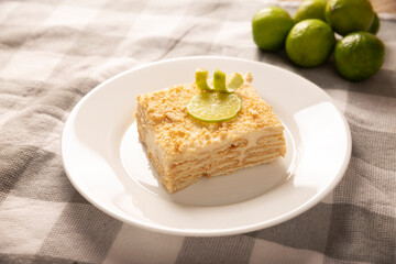 Carlota de Limon, a cold, no-bake dessert made with layers of Maria cookies and a creamy mixture of lemon and condensed milk, an easy homemade recipe very popular in Mexico.