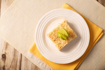 Carlota de Limon, a cold, no-bake dessert made with layers of Maria cookies and a creamy mixture of lemon and condensed milk, an easy homemade recipe very popular in Mexico.