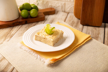 Carlota de Limon, a cold, no-bake dessert made with layers of Maria cookies and a creamy mixture of lemon and condensed milk, an easy homemade recipe very popular in Mexico.