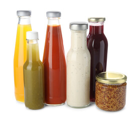 Bottles with different tasty sauces isolated on white