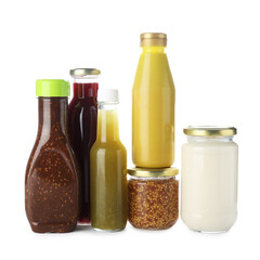 Bottles with different tasty sauces isolated on white