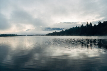 Sunrise over a foggy lake