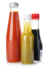 Bottles with different tasty sauces isolated on white