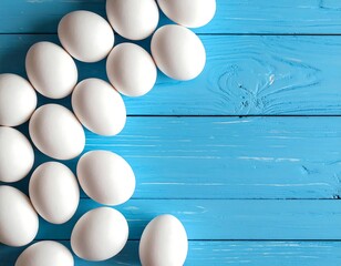 Close-up of white eggs arranged on a vibrant blue, wooden surface