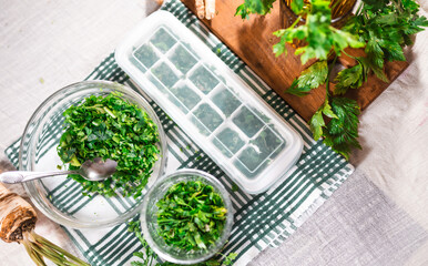 Preparing fresh parsley leaves to freezing for winter.